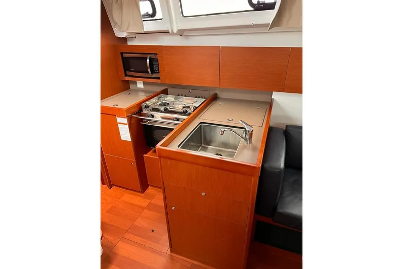 Grey Havens Yacht Photos Pics 2017 Beneteau Oceanis 38.1 yacht kitchen with stove, sink, and microwave.