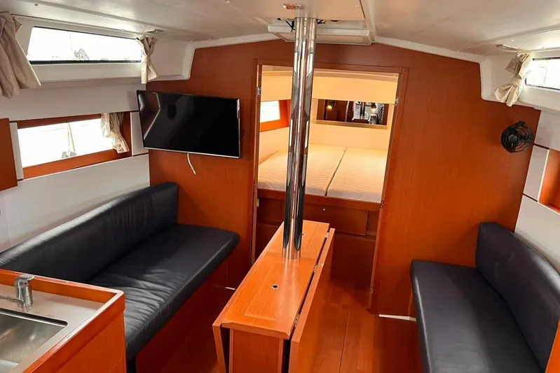 Grey Havens Yacht Photos Pics Interior of 2017 Beneteau Oceanis 38.1 yacht with modern seating and TV.