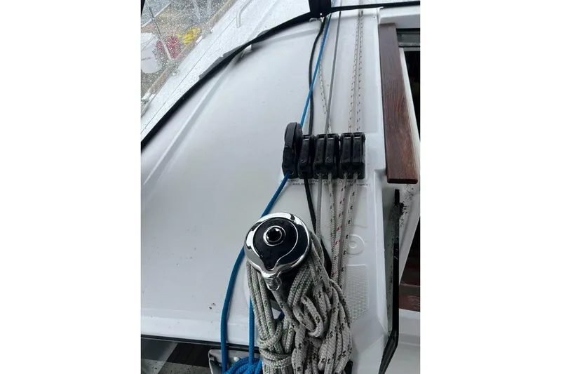 Grey Havens Yacht Photos Pics Close-up of 2017 Beneteau Oceanis 38.1 sailboat deck with winch and ropes.