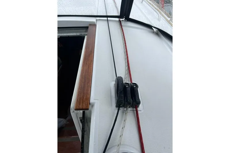 Grey Havens Yacht Photos Pics Beneteau Oceanis 38.1 sailboat deck with ropes and wooden handrail, 2017 model.