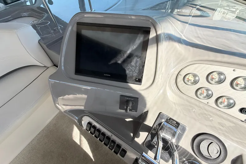 Ursula Yacht Photos Pics Helm of 2006 Cruisers Yachts 370 Express with Garmin display and control panel.