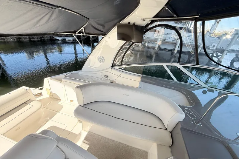 Ursula Yacht Photos Pics 2006 Cruisers Yachts 370 Express interior with seating and water view.