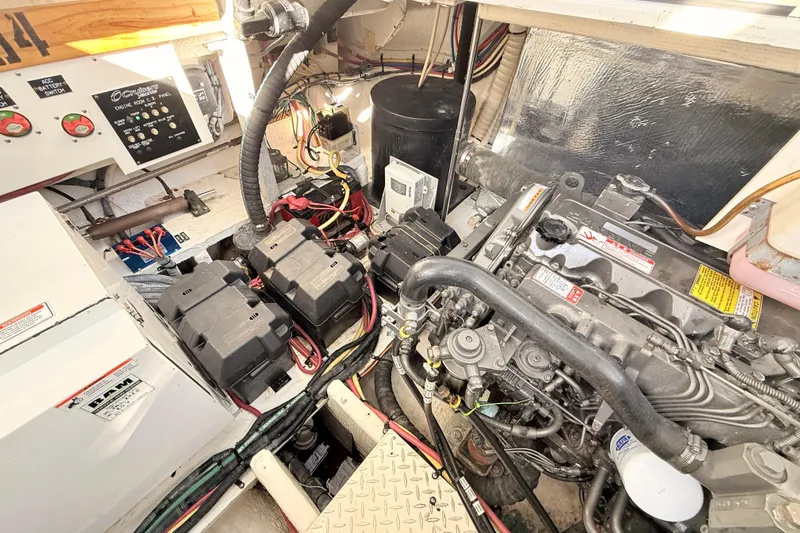 Ursula Yacht Photos Pics Engine room of 2006 Cruisers Yachts 370 Express, showcasing batteries and mechanical components.