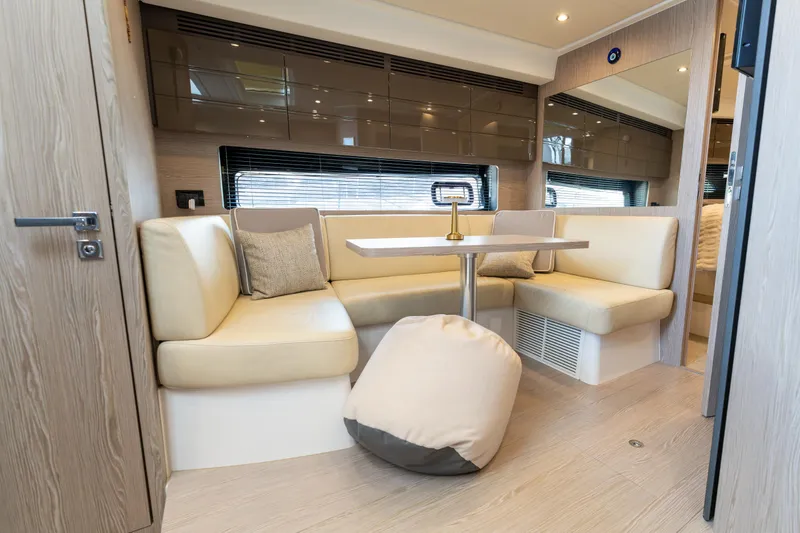  Yacht Photos Pics Luxurious interior of 2023 Azimut Atlantis 45 yacht with modern seating and table.