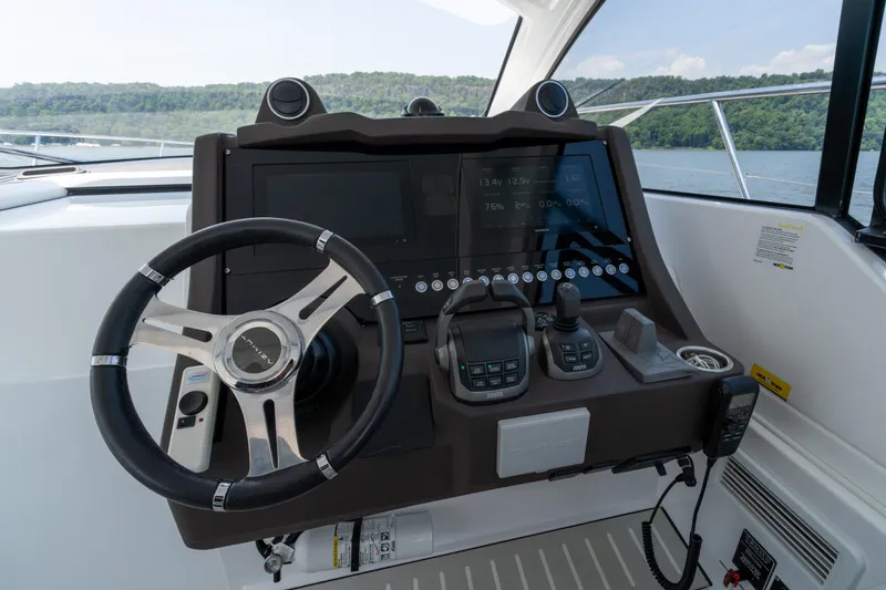  Yacht Photos Pics 2023 Azimut Atlantis 45 helm with modern controls and navigation display.