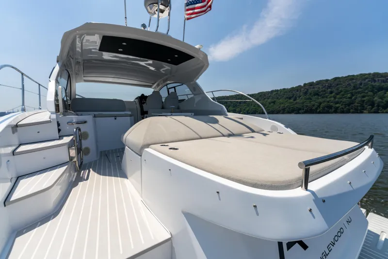  Yacht Photos Pics 2023 Azimut Atlantis 45 yacht with spacious deck and seating, cruising on a sunny day.