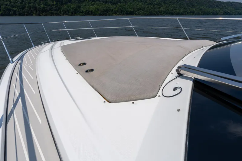  Yacht Photos Pics 2023 Azimut Atlantis 45 yacht deck with sunpad, cruising on a scenic river.