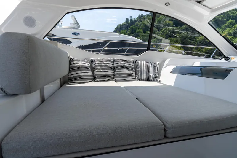  Yacht Photos Pics Luxurious interior of 2023 Azimut Atlantis 45 yacht with comfortable seating and striped cushions.