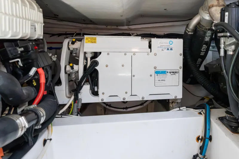  Yacht Photos Pics Engine room of 2023 Azimut Atlantis 45 yacht, showcasing mechanical components and wiring.