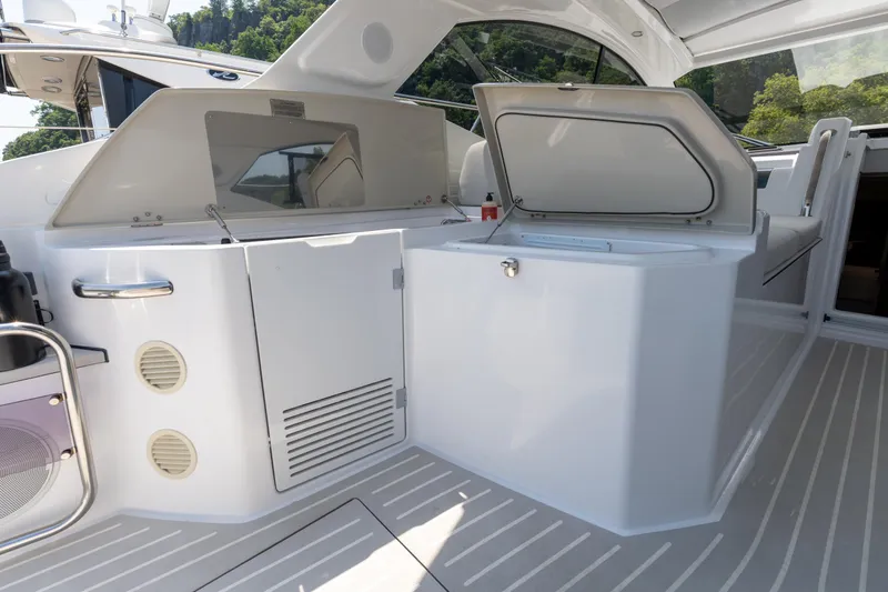  Yacht Photos Pics 2023 Azimut Atlantis 45 yacht interior with open storage compartments.