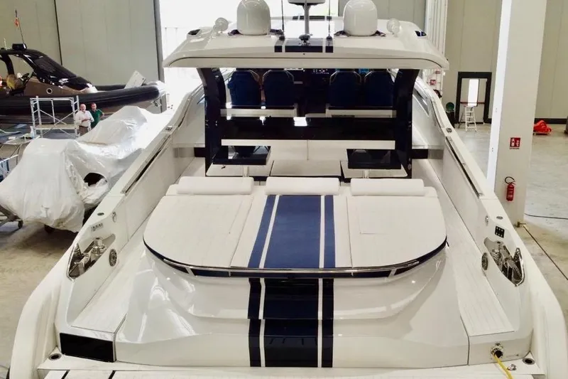  Yacht Photos Pics 2025 SACS Rebel 55 luxury yacht in a showroom, showcasing sleek design and spacious deck.