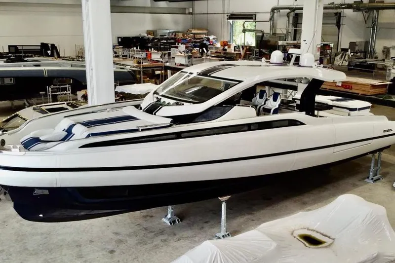  Yacht Photos Pics 2025 SACS Rebel 55 luxury yacht in a showroom, showcasing sleek design and modern features.