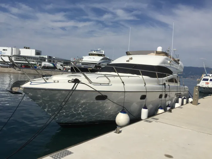  Yacht Photos Pics 1998 Princess 52 Flybridge Motor Yacht docked at marina.