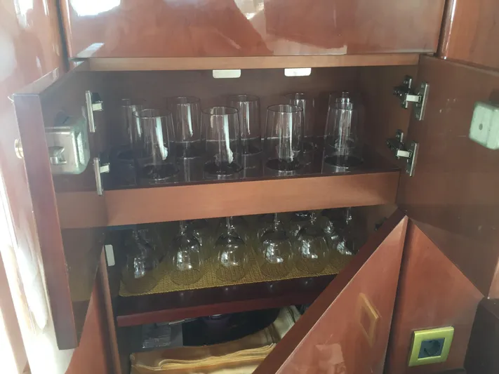  Yacht Photos Pics Glasses in a cabinet on a 1998 Princess 52 Flybridge Yacht.