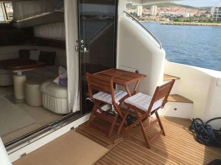  Yacht Photos Pics 1998 Princess 52 Flybridge Yacht with wooden furniture on deck.