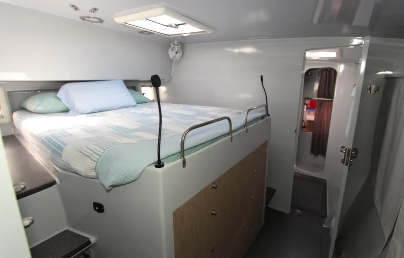 Wabisabi Yacht Photos Pics Cozy cabin interior of 2018 Chris White Atlantic 49 MastFoil yacht with elevated bed.