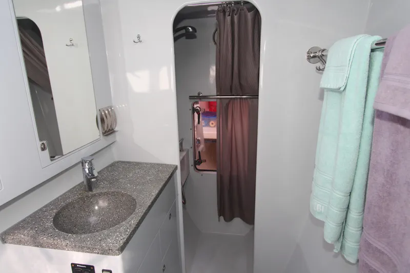 Wabisabi Yacht Photos Pics Modern yacht bathroom with granite sink, shower, and towels; Chris White Atlantic 49 MastFoil 2018.