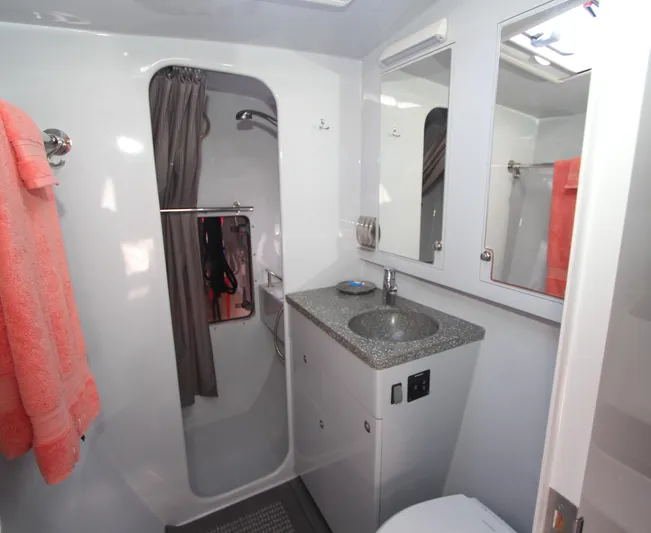 Wabisabi Yacht Photos Pics Bathroom interior of 2018 Chris White Atlantic 49 MastFoil yacht, featuring shower and sink.