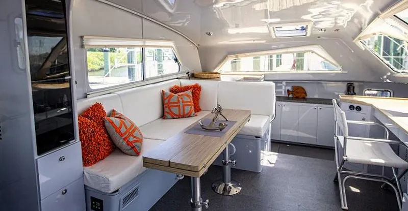 Wabisabi Yacht Photos Pics Luxurious interior of 2018 Chris White Atlantic 49 MastFoil yacht with modern seating and decor.
