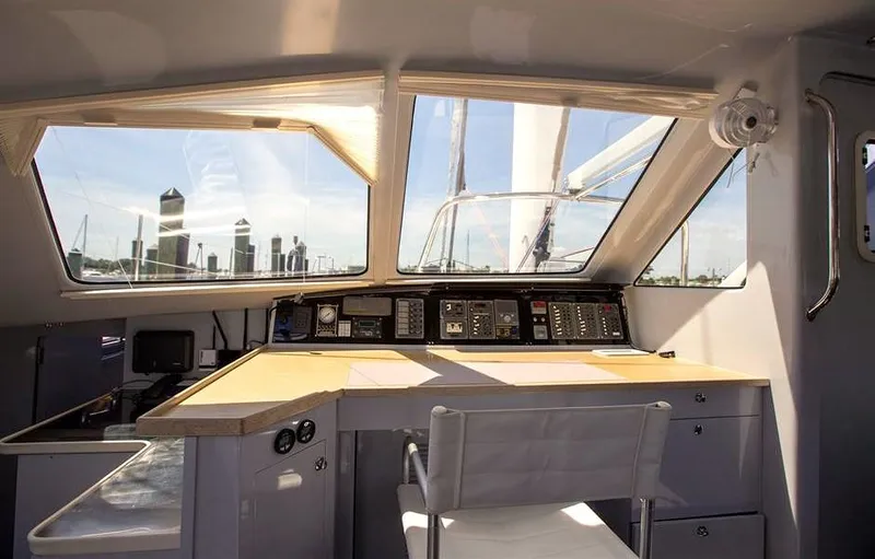 Wabisabi Yacht Photos Pics Interior view of 2018 Chris White Atlantic 49 MastFoil yacht cockpit with city skyline.