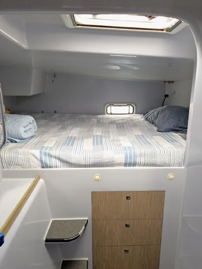 Wabisabi Yacht Photos Pics Cozy cabin interior of 2018 Chris White Atlantic 49 MastFoil with bed and storage.