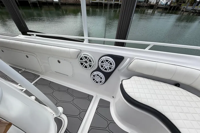  Yacht Photos Pics 2020 Glasstream 360 SCX boat interior with speakers and cushioned seating.