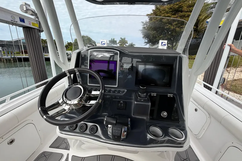  Yacht Photos Pics 2020 Glasstream 360 SCX boat dashboard with steering wheel and navigation screens.