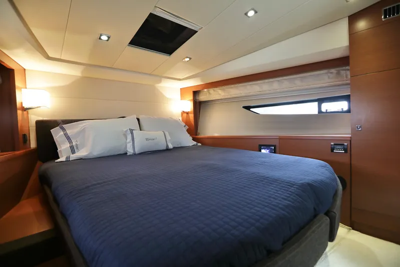 Perseus Yacht Photos Pics Luxurious bedroom interior of 2013 Prestige 500 yacht with modern lighting and cozy bedding.