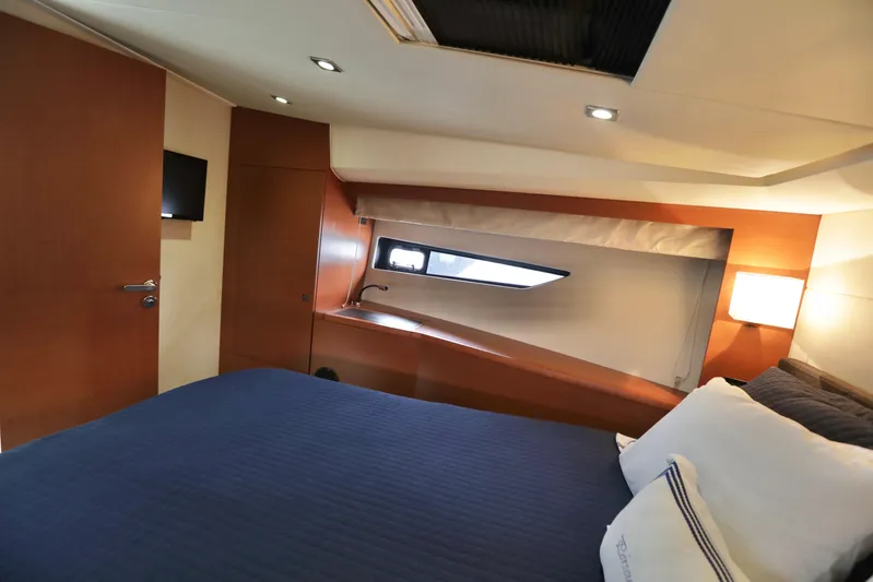 Perseus Yacht Photos Pics Luxurious bedroom interior of 2013 Prestige 500 yacht with modern amenities.