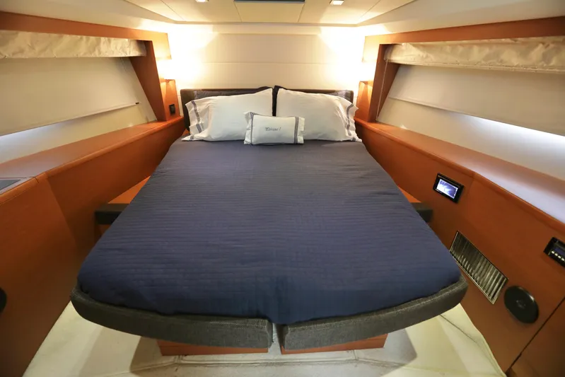 Perseus Yacht Photos Pics Luxurious bedroom in 2013 Prestige 500 yacht with modern lighting and cozy bedding.