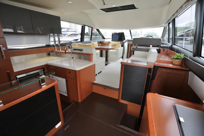 Perseus Yacht Photos Pics Luxurious interior of a 2013 Prestige 500 yacht with modern kitchen and seating area.