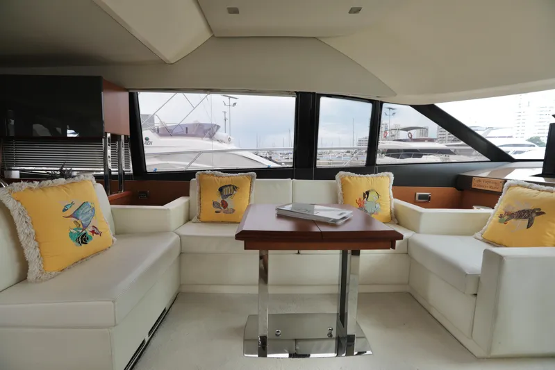 Perseus Yacht Photos Pics Luxurious interior of a 2013 Prestige 500 yacht with white seating and decorative pillows.