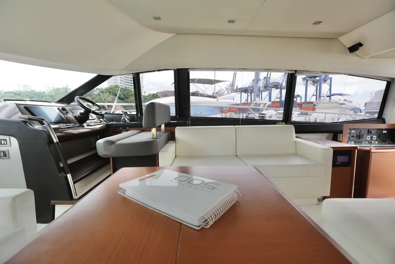 Perseus Yacht Photos Pics Interior of 2013 Prestige 500 yacht with modern furnishings and marina view.