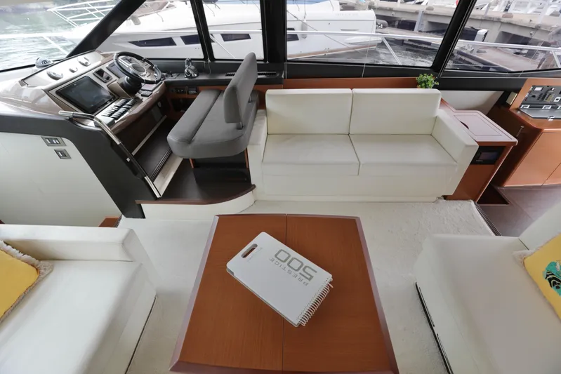 Perseus Yacht Photos Pics Interior of 2013 Prestige 500 yacht with helm, seating, and table.