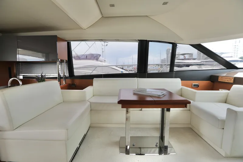 Perseus Yacht Photos Pics Luxurious interior of a 2013 Prestige 500 yacht with white leather seating.