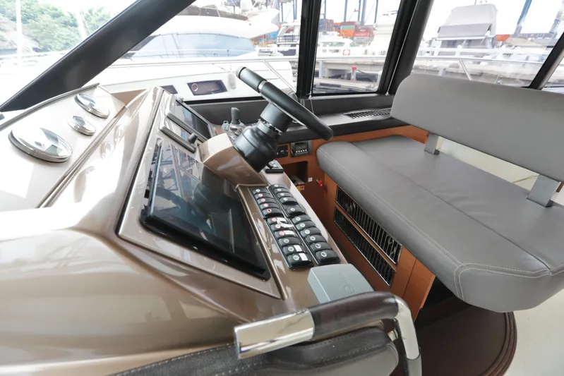 Perseus Yacht Photos Pics Helm station of 2013 Prestige 500 yacht with modern controls and seating.