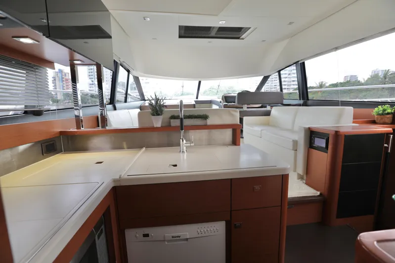 Perseus Yacht Photos Pics Luxurious interior of a 2013 Prestige 500 yacht with modern kitchen and seating area.