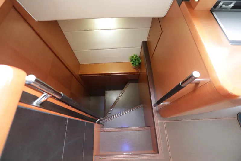 Perseus Yacht Photos Pics Interior stairs of 2013 Prestige 500 yacht with wooden finish and modern design.