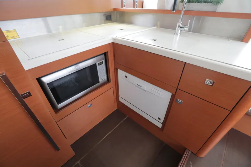 Perseus Yacht Photos Pics Modern kitchen area in 2013 Prestige 500 yacht with microwave and dishwasher.