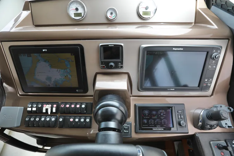 Perseus Yacht Photos Pics Control panel of a 2013 Prestige 500 yacht with navigation and monitoring systems.