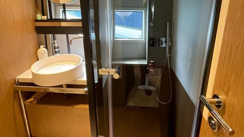  Yacht Photos Pics Luxurious bathroom in 2023 Ferretti Yachts 720, featuring modern fixtures and elegant design.