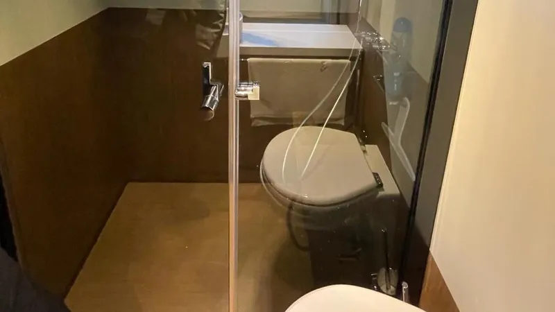  Yacht Photos Pics Modern bathroom interior on 2023 Ferretti Yachts 720, featuring sleek design and glass shower enclosure.