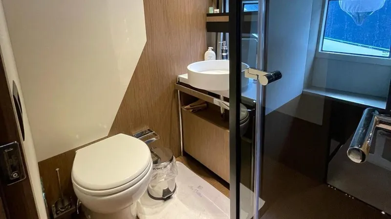  Yacht Photos Pics Luxury bathroom in 2023 Ferretti Yachts 720, featuring modern fixtures and elegant design.