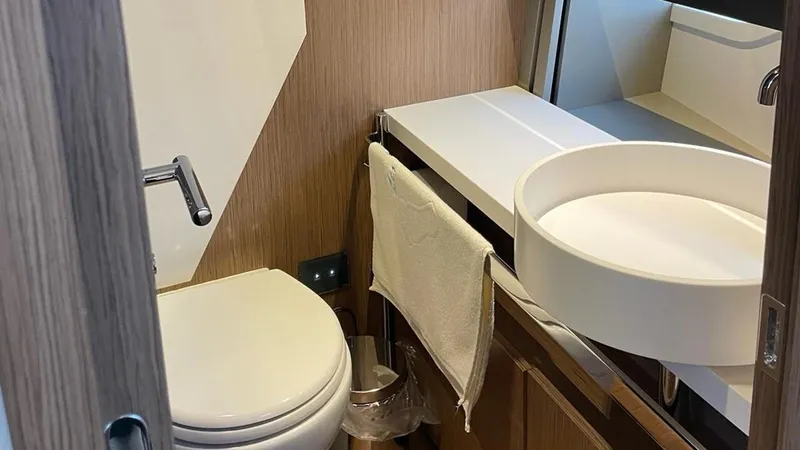  Yacht Photos Pics Luxurious bathroom in 2023 Ferretti Yachts 720, featuring modern fixtures and elegant design.