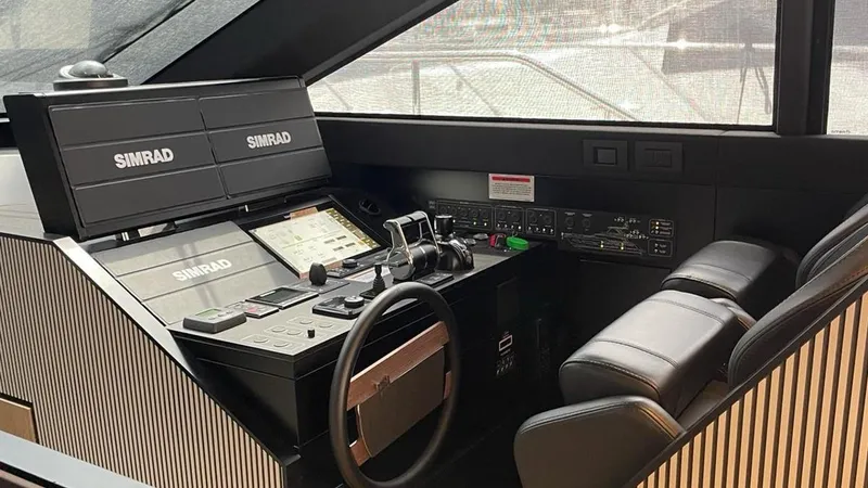  Yacht Photos Pics Helm station of 2023 Ferretti Yachts 720 with Simrad navigation system.