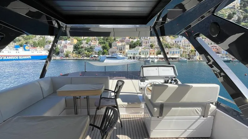  Yacht Photos Pics Luxurious 2023 Ferretti Yachts 720 with spacious deck overlooking scenic harbor.