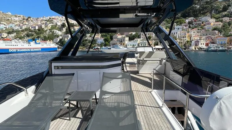  Yacht Photos Pics Luxurious 2023 Ferretti Yachts 720 with spacious deck, docked in scenic harbor.