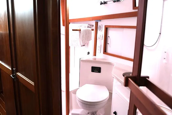 Melissa Marie 2 Yacht Photos Pics 2006 Sabre 38 Hardtop Express bathroom with wooden accents and modern fixtures.