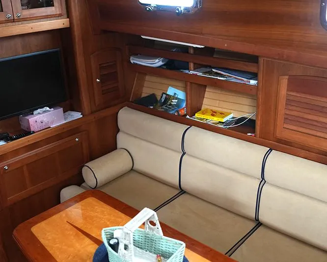 Melissa Marie 2 Yacht Photos Pics Interior of 2006 Sabre 38 Hardtop Express with wooden cabinetry and beige seating.