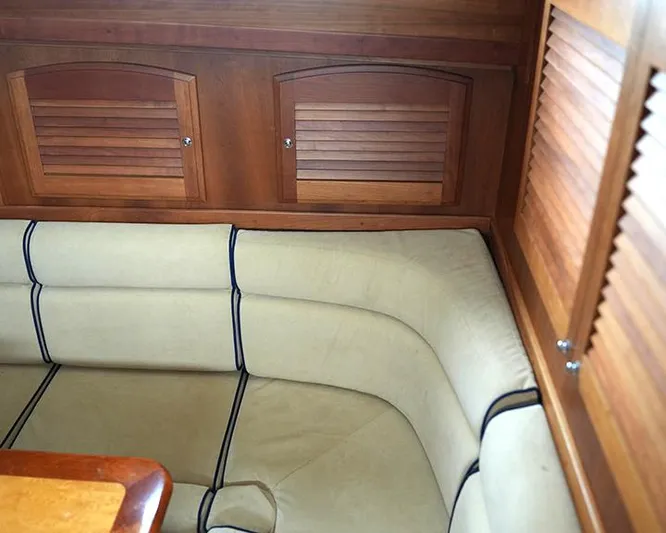 Melissa Marie 2 Yacht Photos Pics 2006 Sabre 38 Hardtop Express interior with beige seating and wooden cabinetry.